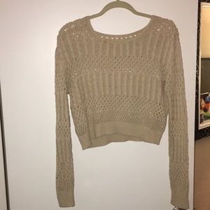 Cream colored cropped sweater.